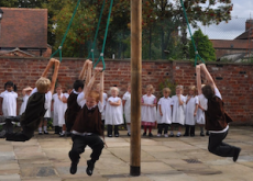 children playing on the swing in the museum playground