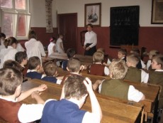 children having lesson in Victorian Schoolroom