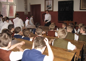 children having lesson in Victorian Schoolroom